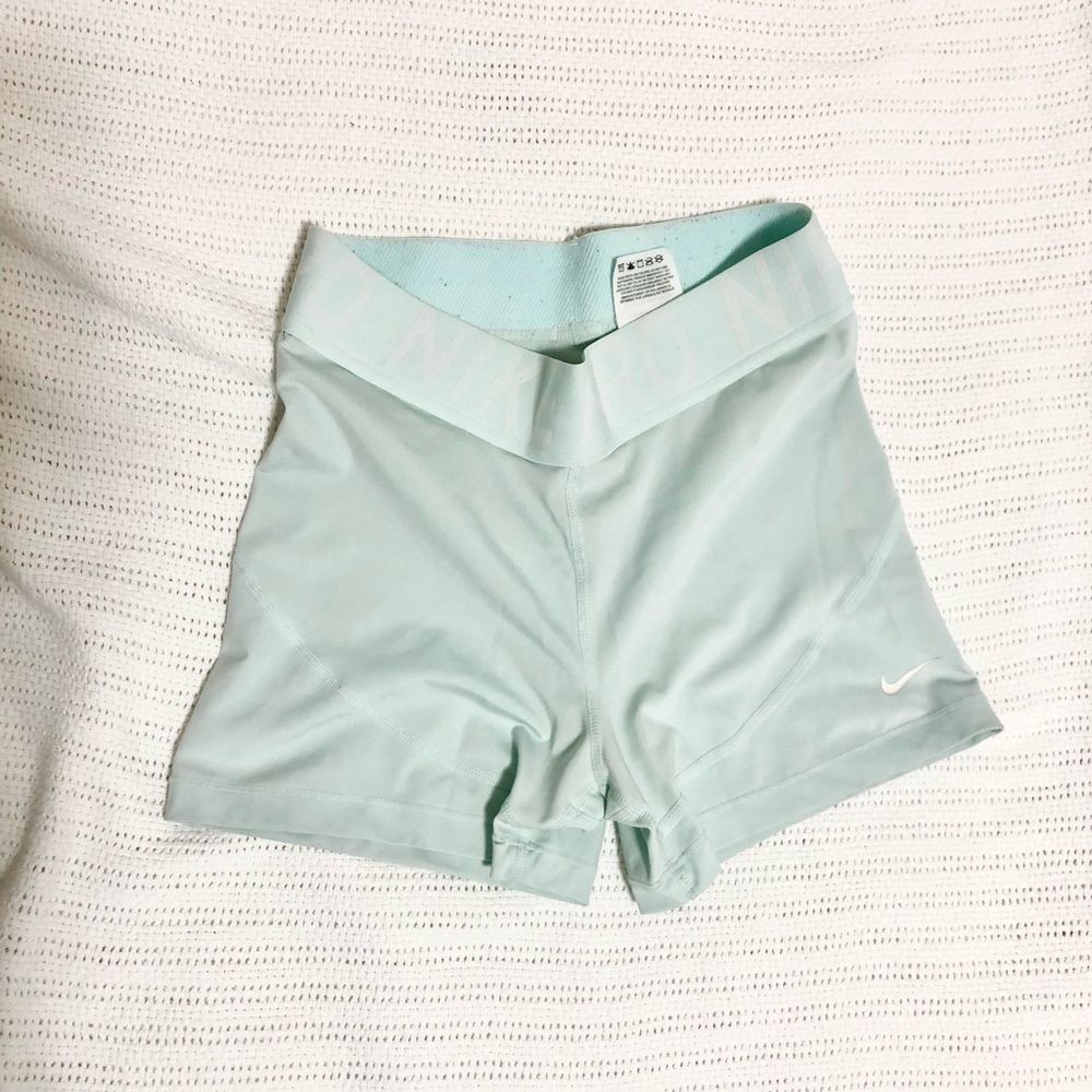NIKE women’s spandex shorts, ice blue size M